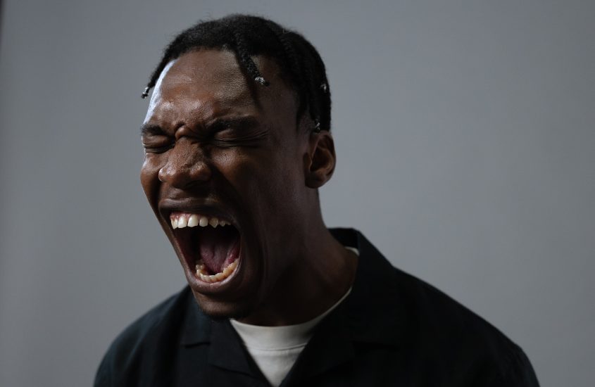 Yound black man showing anger emotion